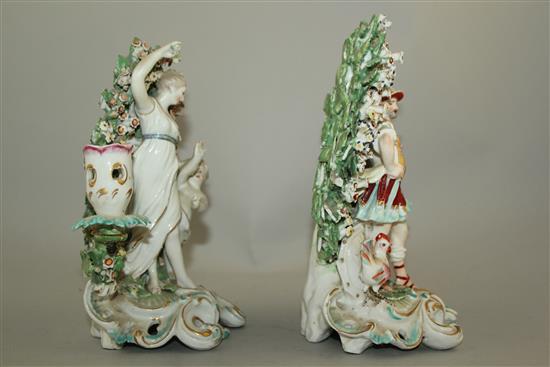 A pair of Derby candlestick groups, c.1770, 20cm and 21.5cm